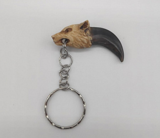 a wolf's claw with a head made of elk horn