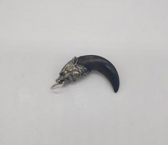 a wolf's claw with a metal head